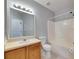 Well-lit bathroom featuring a vanity with storage and a shower-tub combination at 9516 Amberdale Ct # 202, Riverview, FL 33569
