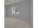 Light-filled bedroom with plush carpeting and a window providing natural light at 9516 Amberdale Ct # 202, Riverview, FL 33569