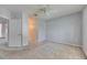 Bright bedroom features neutral carpet, light gray walls, and a ceiling fan for added comfort at 9516 Amberdale Ct # 202, Riverview, FL 33569