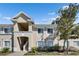 Exterior of a two-story condo in a community featuring multiple windows and neutral color palette at 9516 Amberdale Ct # 202, Riverview, FL 33569