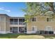 Exterior view of a building with screened-in balconies and a well-kept lawn at 9516 Amberdale Ct # 202, Riverview, FL 33569