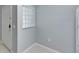 Empty room near front door with a glass block window and tiled flooring at 9516 Amberdale Ct # 202, Riverview, FL 33569