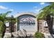 Entrance sign for the Villages of Bloomingdale, surrounded by brick columns and tropical foliage at 9516 Amberdale Ct # 202, Riverview, FL 33569
