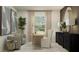 Bright office with stylish decor, two chairs, a large mirror, and light-filtering curtains at 10225 Purple Leaf Ct, Riverview, FL 33578