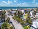 Charming home tucked near the beach and nestled amongst mature trees and lush landscaping at 107 13Th Ave, St Pete Beach, FL 33706