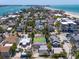 Property near the beach boasts a unique roof and is surrounded by lush landscaping at 107 13Th Ave, St Pete Beach, FL 33706