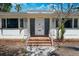Inviting home entrance with brick steps, classic door, and decorative window shutters at 107 13Th Ave, St Pete Beach, FL 33706