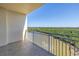 Private balcony with panoramic views of the surrounding landscape and water features, ideal for outdoor relaxation at 10851 Mangrove Cay Ne Ln # 714, St Petersburg, FL 33716