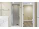 Modern bathroom featuring a glass enclosed shower and tile flooring at 10851 Mangrove Cay Ne Ln # 714, St Petersburg, FL 33716