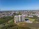 Stunning condominium building with multiple balconies overlooking lush landscaping and a serene lake at 10851 Mangrove Cay Ne Ln # 714, St Petersburg, FL 33716