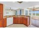 Modern kitchen with granite countertops, stainless steel dishwasher and a large bar overlooking the living area at 10851 Mangrove Cay Ne Ln # 714, St Petersburg, FL 33716