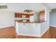 Open kitchen with granite countertops and wooden cabinets at 10851 Mangrove Cay Ne Ln # 714, St Petersburg, FL 33716