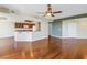 Open-concept living space with hardwood floors and a kitchen view, perfect for entertaining and everyday living at 10851 Mangrove Cay Ne Ln # 714, St Petersburg, FL 33716
