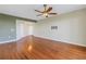 Spacious living room with hardwood floors and modern ceiling fan at 10851 Mangrove Cay Ne Ln # 714, St Petersburg, FL 33716