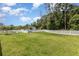 Expansive dog park featuring lush green grass and a secure perimeter fence at 10924 Brightleaf Ct, Riverview, FL 33569