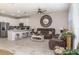 Open-concept living area flows into a kitchen with seating at the breakfast bar at 10924 Brightleaf Ct, Riverview, FL 33569