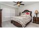 Spacious main bedroom featuring a ceiling fan and natural light from a window at 10924 Brightleaf Ct, Riverview, FL 33569