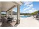 View of the community pool with a covered lounge area and comfortable seating at 10924 Brightleaf Ct, Riverview, FL 33569
