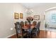 Formal dining room featuring a wooden table, upholstered chairs, and elegant chandelier at 11225 Godwit Ct, New Port Richey, FL 34654