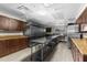 Commercial kitchen with stainless steel appliances, ample counter space, and modern fixtures at 11225 Godwit Ct, New Port Richey, FL 34654