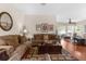 Comfortable living room with plush sofas, decorative pillows, and ample natural light at 11225 Godwit Ct, New Port Richey, FL 34654