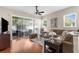 Bright living room with sliding glass doors, comfortable seating, and neutral decor at 11225 Godwit Ct, New Port Richey, FL 34654
