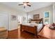 Spacious bedroom with a ceiling fan and wood floors, offering a comfortable and inviting atmosphere at 11225 Godwit Ct, New Port Richey, FL 34654
