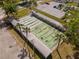 An overhead view of shuffleboard courts near a parking lot, landscaping and palm trees at 11225 Godwit Ct, New Port Richey, FL 34654