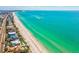 Breathtaking aerial view of a pristine coastline with turquoise water, sandy beaches, and luxury homes at 11549 48Th Ave N, St Petersburg, FL 33708