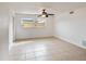 Neutral bedroom featuring tile flooring, ceiling fan, and a window view at 11549 48Th Ave N, St Petersburg, FL 33708