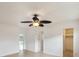 Bedroom with ceiling fan, beige tiling, and closet space at 11549 48Th Ave N, St Petersburg, FL 33708
