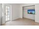 Bedroom with neutral tile floors and access to outdoor patio from a large glass door at 11549 48Th Ave N, St Petersburg, FL 33708