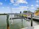 Private boat lift on waterfront property features a secure and functional design, ideal for boat owners and water sports enthusiasts at 11549 48Th Ave N, St Petersburg, FL 33708