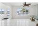 Bright dining room with tile floors, modern table, and large windows with water view at 11549 48Th Ave N, St Petersburg, FL 33708