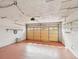 Spacious garage with painted floor, overhead door with windows, and built-in shelving at 11549 48Th Ave N, St Petersburg, FL 33708