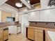 Bright kitchen featuring wooden cabinets and ample countertop space with views to the hallway at 11549 48Th Ave N, St Petersburg, FL 33708