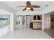 Spacious living room featuring tile flooring, recessed lighting, and views to a waterway at 11549 48Th Ave N, St Petersburg, FL 33708