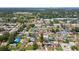 Aerial view of the neighborhood and surrounding area showcasing homes, trees, and local roads at 1165 63Rd S Ave, St Petersburg, FL 33705
