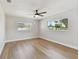 Bright bedroom featuring hardwood floors, two windows, and neutral paint at 1165 63Rd S Ave, St Petersburg, FL 33705