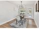 Dining room view features modern lighting, table setting, and backyard access at 1165 63Rd S Ave, St Petersburg, FL 33705