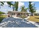 Inviting single-story home boasting a freshly paved driveway and beautifully landscaped front yard at 1165 63Rd S Ave, St Petersburg, FL 33705