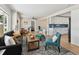 Open-concept living room with modern furniture, bright windows, and an adjacent kitchen area with white cabinetry at 1165 63Rd S Ave, St Petersburg, FL 33705