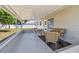 Comfortable covered patio area with wicker furniture, great for outdoor living at 1165 63Rd S Ave, St Petersburg, FL 33705