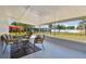 Covered outdoor patio with stylish seating, ideal for enjoying the outdoor space at 1165 63Rd S Ave, St Petersburg, FL 33705