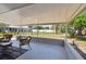 Covered outdoor patio with seating, perfect for relaxing and enjoying the backyard view at 1165 63Rd S Ave, St Petersburg, FL 33705