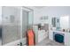 Gorgeous bathroom featuring tiled shower, soaking tub, vanity area and neutral color palette at 12315 Dora Trail, Parrish, FL 34219