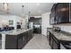 Spacious kitchen featuring a large island, stainless steel appliances, and ample counter space at 12315 Dora Trail, Parrish, FL 34219