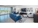 Bright living room with stylish decor, comfortable seating, and a view of the outdoor patio at 12315 Dora Trail, Parrish, FL 34219