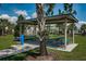 A shaded picnic area with tables, seating, and a water fountain, perfect for outdoor gatherings at 12315 Dora Trail, Parrish, FL 34219