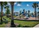 A neighborhood playground featuring slides, swings, and play structures for enjoyment at 12315 Dora Trail, Parrish, FL 34219